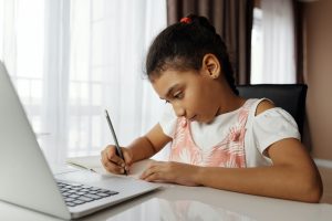 girl doing work at computer